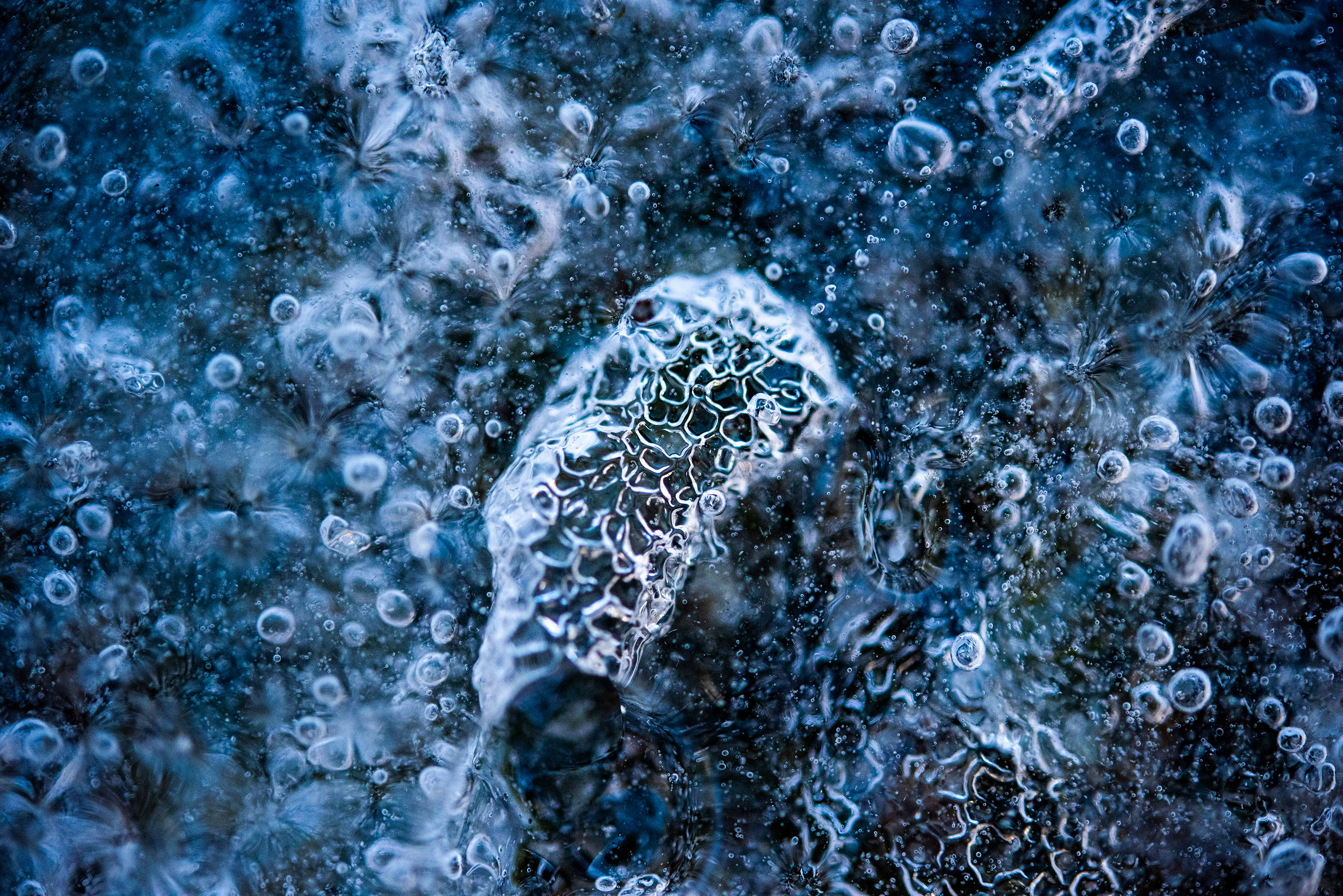 Abstract and macro photography of a frozen road leading to Andermatt, Switzerland. Image by Jennifer Esseiva.
