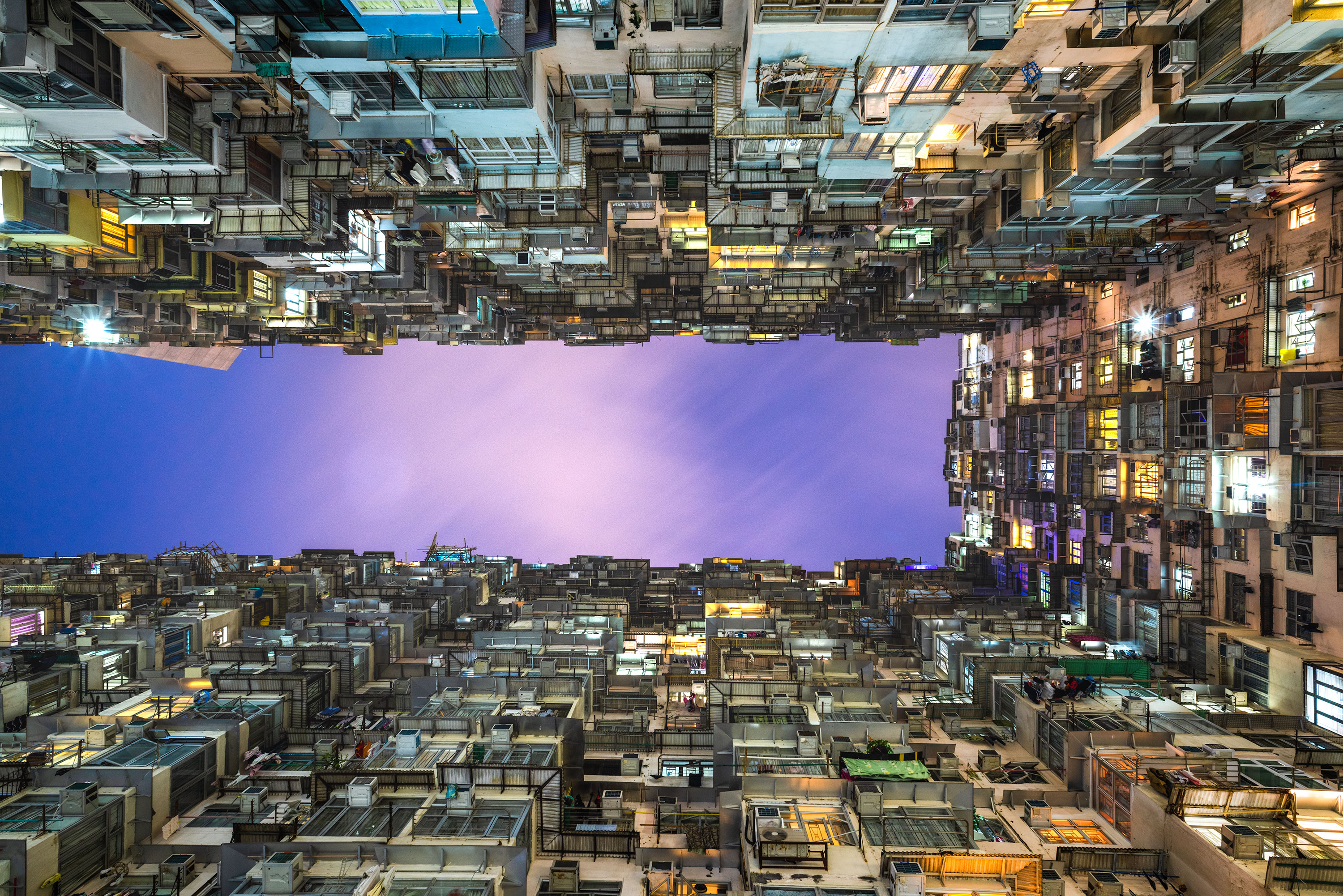 Night photography of the monster building in Hong Kong taken by Jennifer Esseiva.