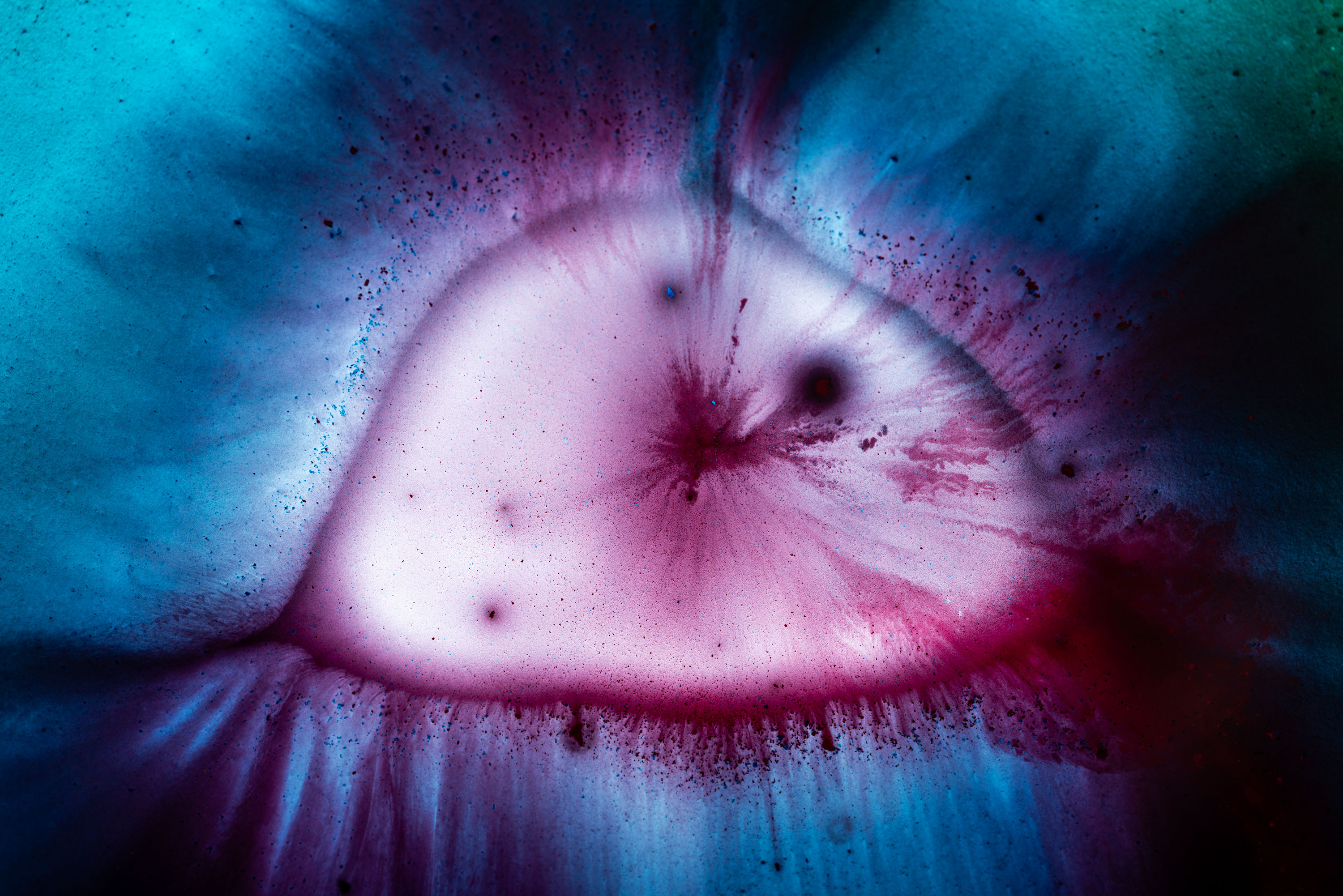 Cyan and magenta watercolor close-up photography. Image by Jennifer Esseiva.
