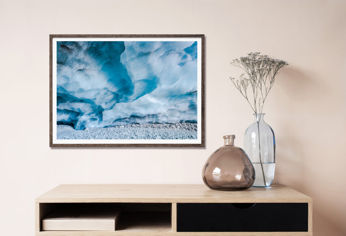 Framed photograph of an ice cave shown in a living room.