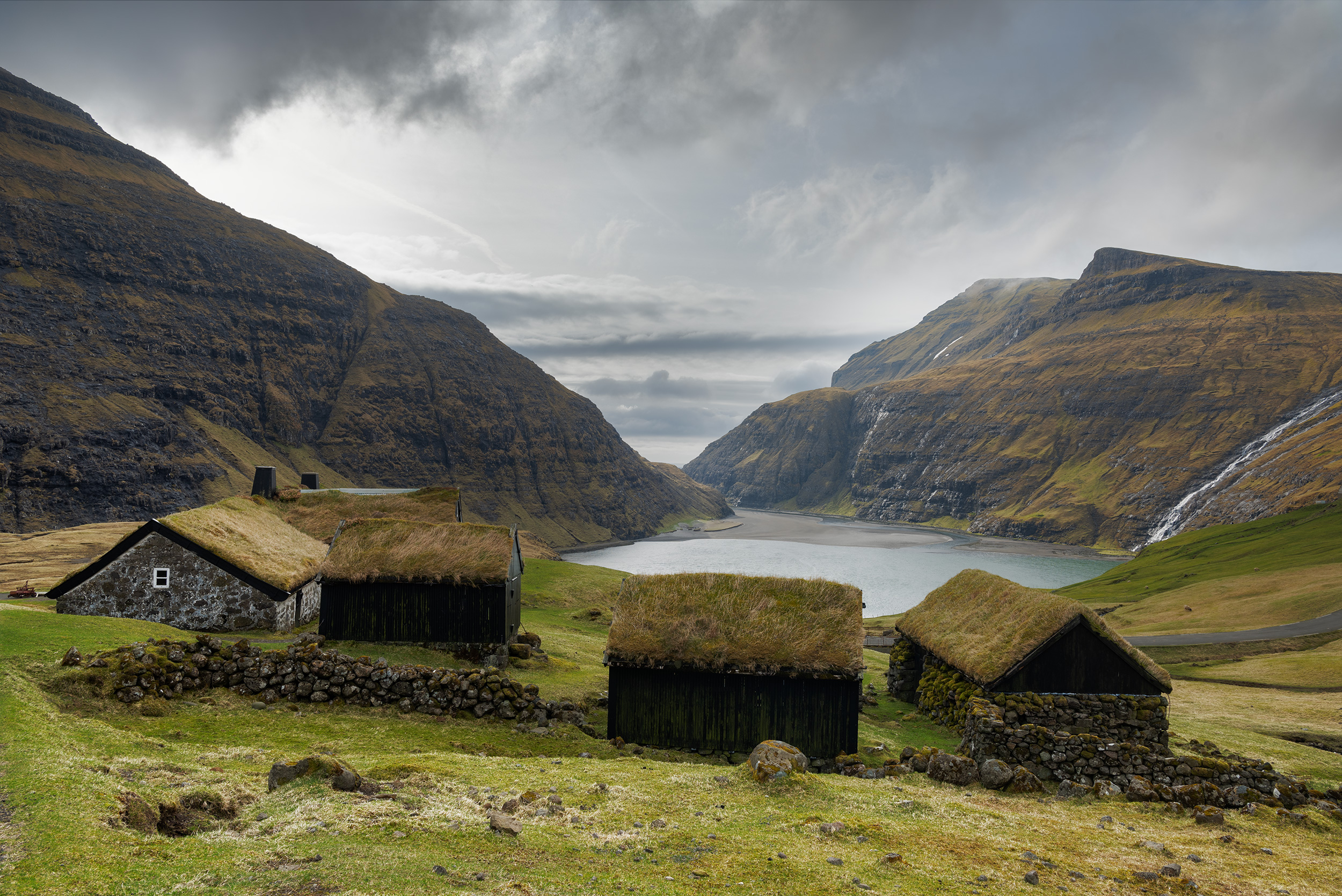 View of the village of Saksun and its grass-roofed houses on the island of Streymoy, Faroe Islands.