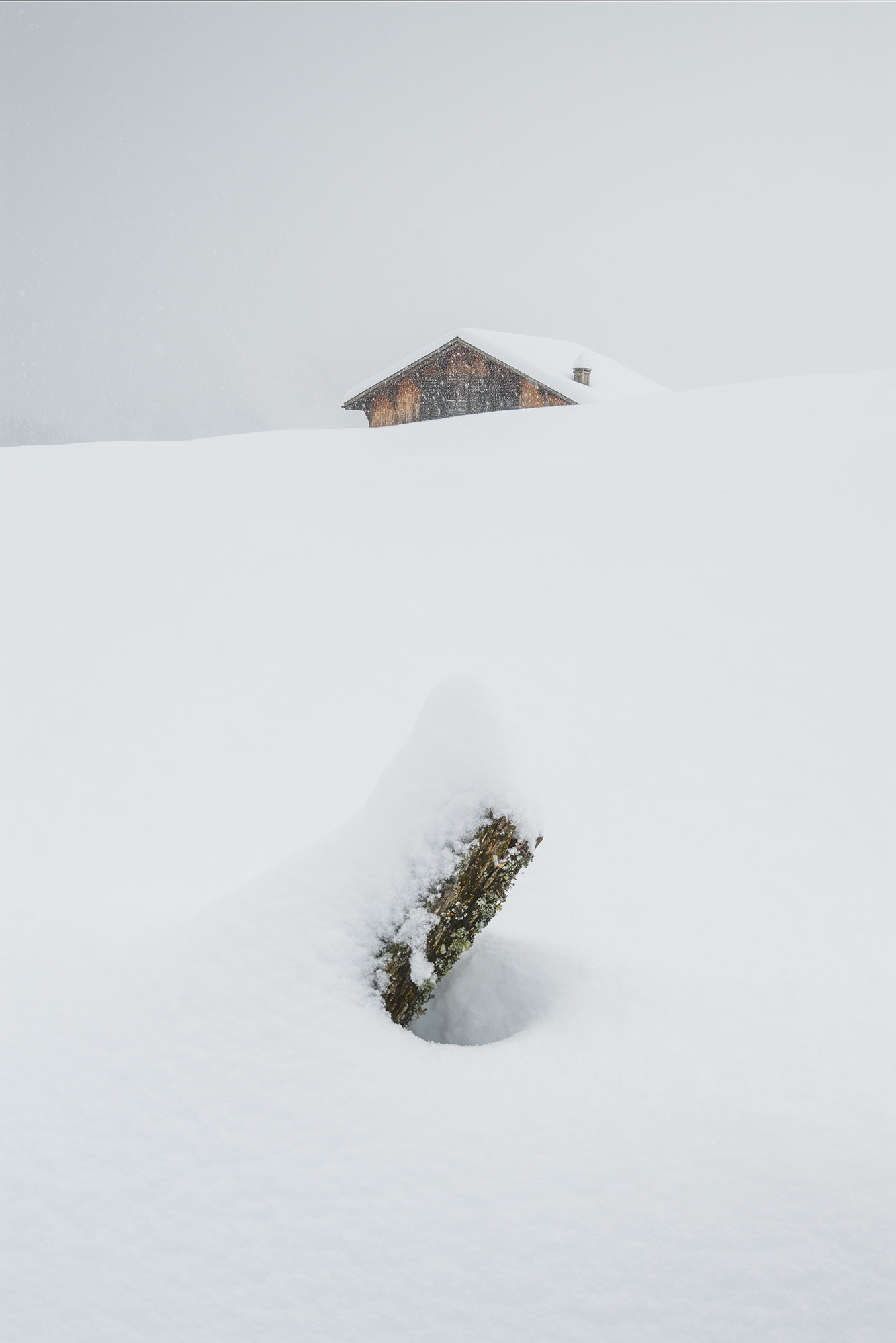 Swiss mountain landscape in a snowstorm.