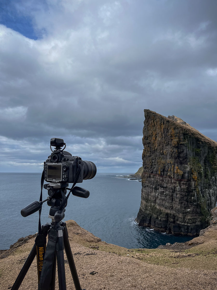 This captivating image captures a unique perspective as my Nikon D810 frames the awe-inspiring Drangarnir Sea Arch in the Faroe Islands.