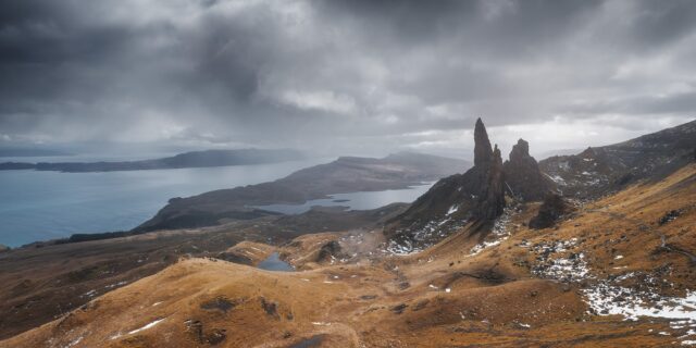 Experience the awe-inspiring grandeur of Skye Island, Scotland, with this epic landscape photography captured by Swiss photographer Jennifer Esseiva and her Nikon D810. Behold the iconic silhouette of the Old Man of Storr against a backdrop of dramatic skies, as Jennifer Esseiva masterfully captures the timeless beauty of this rugged landscape. The towering rock formations and swirling clouds evoke a sense of ancient mystique and untamed wilderness, inviting viewers to embark on a visual journey through the heart of the Scottish Highlands. Join Esseiva on this extraordinary adventure where every frame tells a story of nature's raw power and breathtaking beauty.
