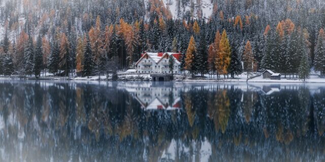 Experience the enchanting allure of a mystical house nestled within the snowy forests of the Dolomites, Italy. Set against the serene backdrop of Anterselva lake, this captivating scene is expertly captured through the lens of landscape photography virtuoso Jennifer Esseiva and her trusted Nikon D810 camera. Each image tells a tale of tranquility and wonder, as the ethereal beauty of the snowy forest reflects upon the still waters of the lake. Immerse yourself in the spellbinding charm of Italy's iconic landscape, brought to life with unparalleled artistry by Jennifer Esseiva. Explore the breathtaking imagery of this mystical house in the Dolomites, and let the beauty of nature's majesty inspire your soul.