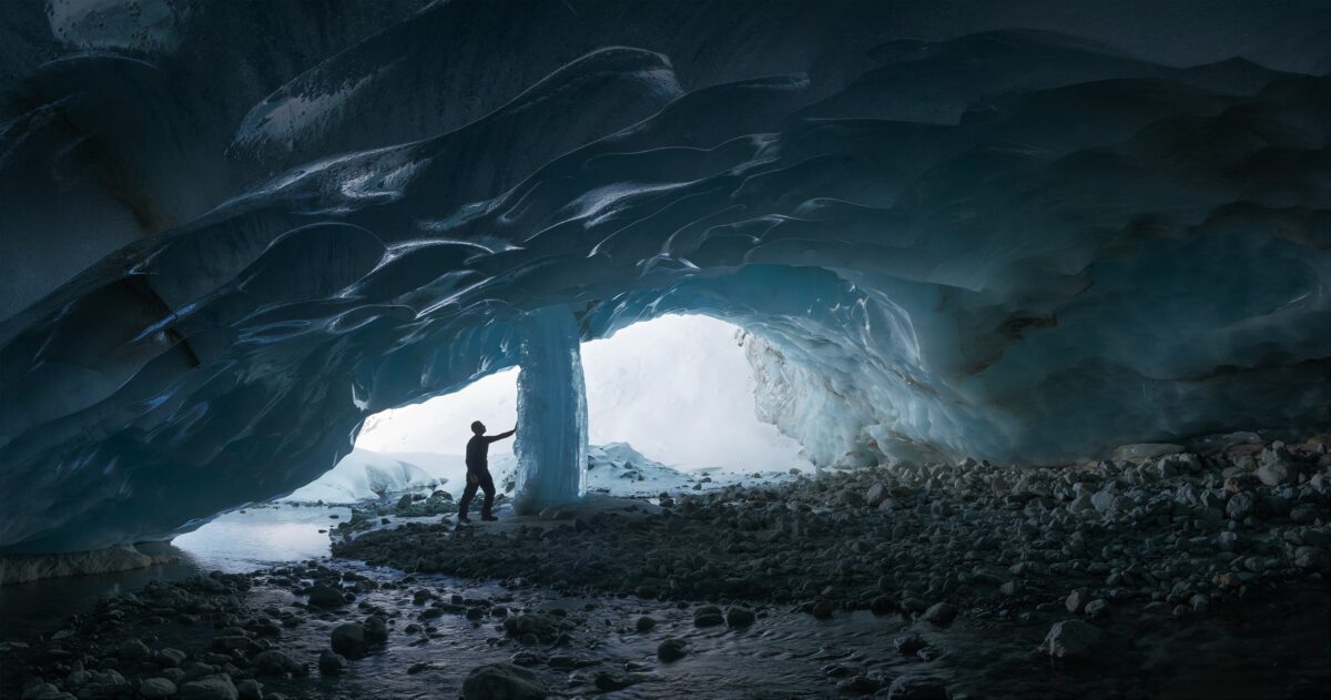 Panoramic view of Zinal ice cave in the Swiss Alps, Valais, with detailed glacier formations.