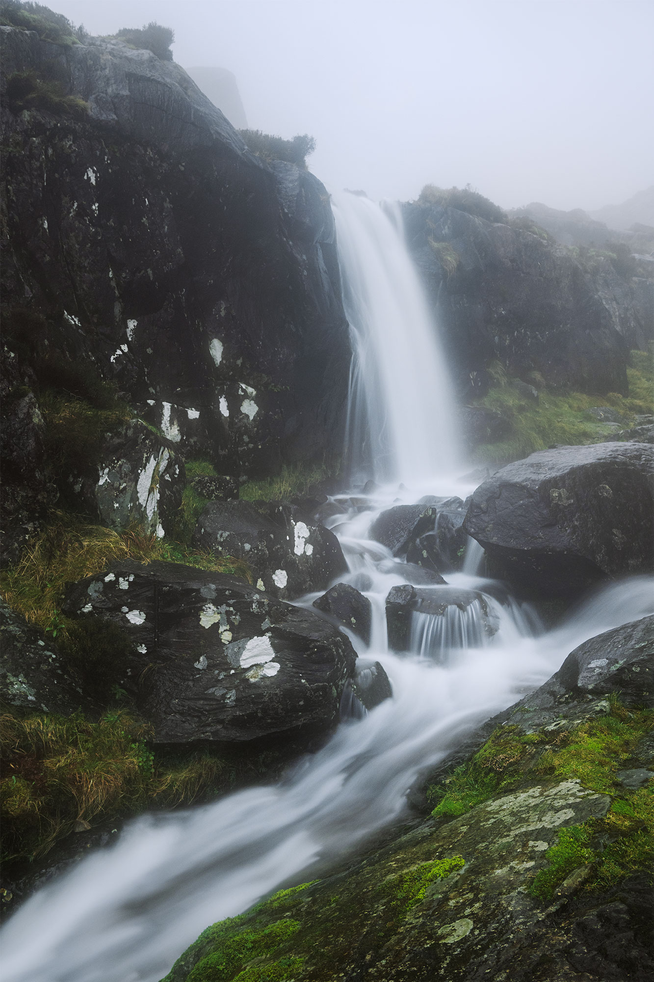 Long exposure photography of the Connor Pass Waterfall on the Dingle Peninsula, Ireland. Captured on a moody, foggy afternoon with a Nikon Z8.