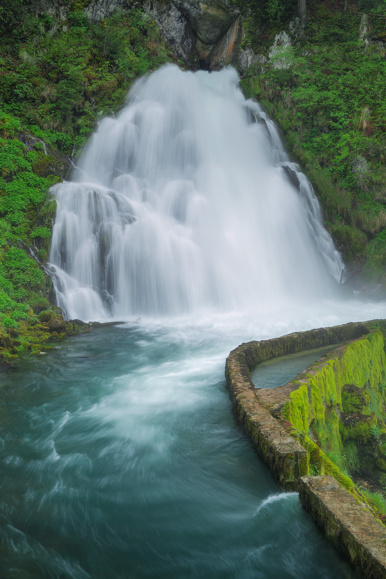 Landscape photography of Jaun Waterfall in the Canton of Fribourg, Switzerland, captured in spring. The long exposure shot, taken with the Nikon Z8, beautifully showcases the waterfall's flow.