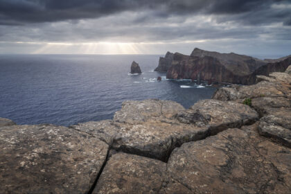 Ponta de São Lourenço in Madeira, Portugal, with dramatic coastline and ray of light over the sea.