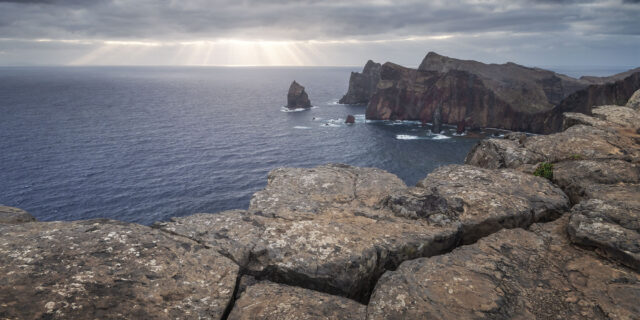 Ponta de São Lourenço in Madeira, Portugal, with dramatic coastline and ray of light over the sea.