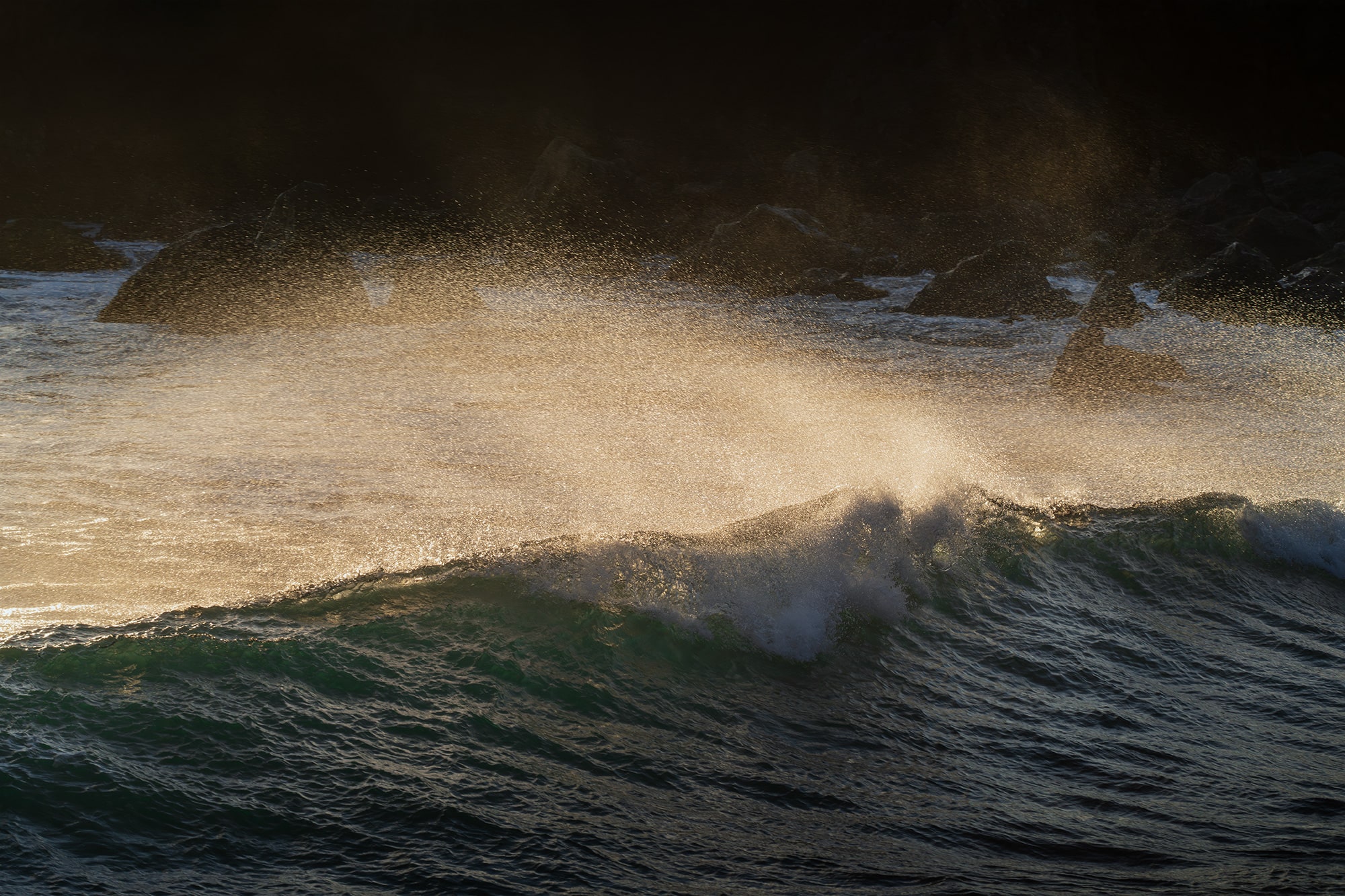Powerful crashing waves at La Cresta del Dragón Colorao near El Golfo, Lanzarote, Canary Islands, captured at sunset with dramatic ocean light.