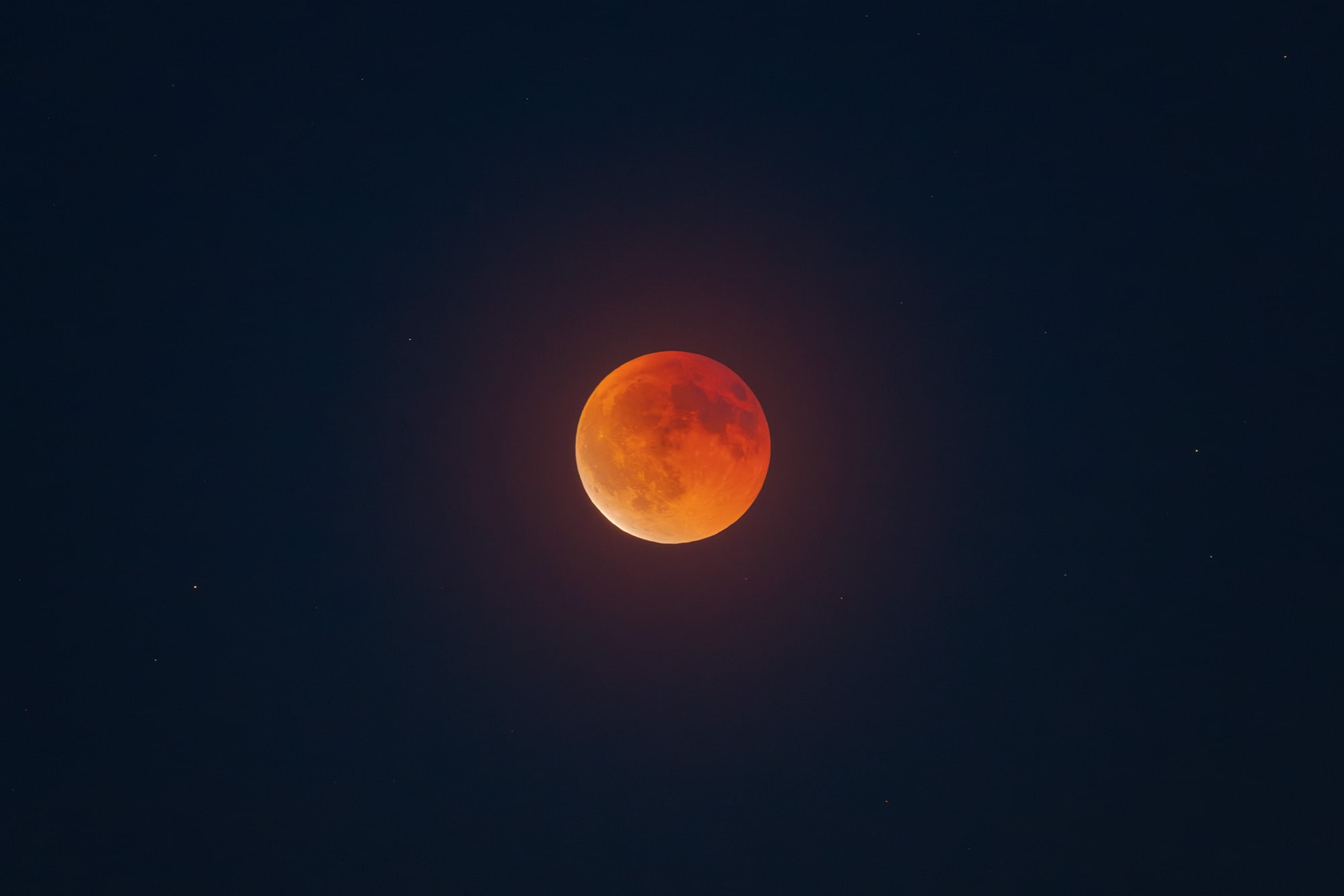 Blood moon photographed on 07 September 2025 above the Swiss sky, overlooking the Lavaux vineyard region near Lausanne. Night sky and astrophotography scene.
