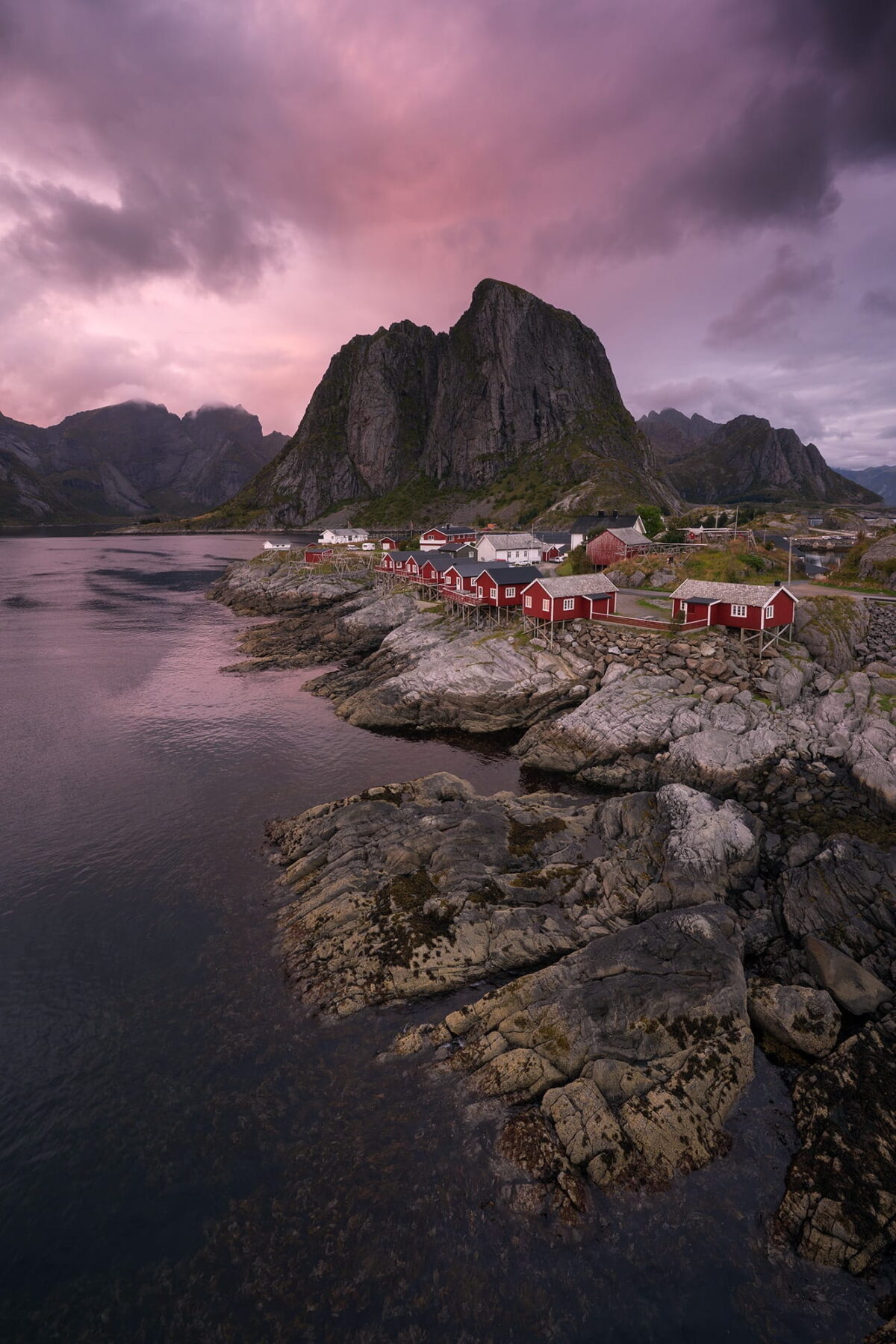 Hamnøy red cabins and mountains at sunset, Lofoten Islands, Norway