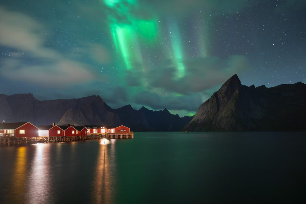 Northern lights over Hamnøy and Reinefjorden, Lofoten Islands, Norway